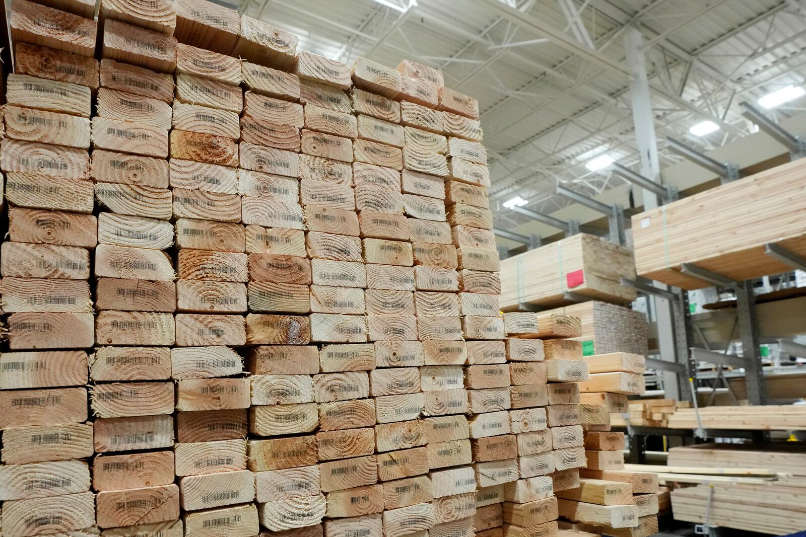 Stacks of lumber are set up on shelves at a local Lowes store Tuesday, April 1, 2025, in Tempe, Ariz. (AP Photo/Ross D. Franklin)