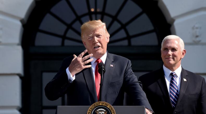 FILE: U.S. President Donald Trump comments on the 4.1 percent economic growth for the second quarter as Vice President Mike Pence looks on during a statement in the South Lawn of the White House July 27, 2018 in Washington, D.C. (Olivier Douliery/Abaca Press/TNS)