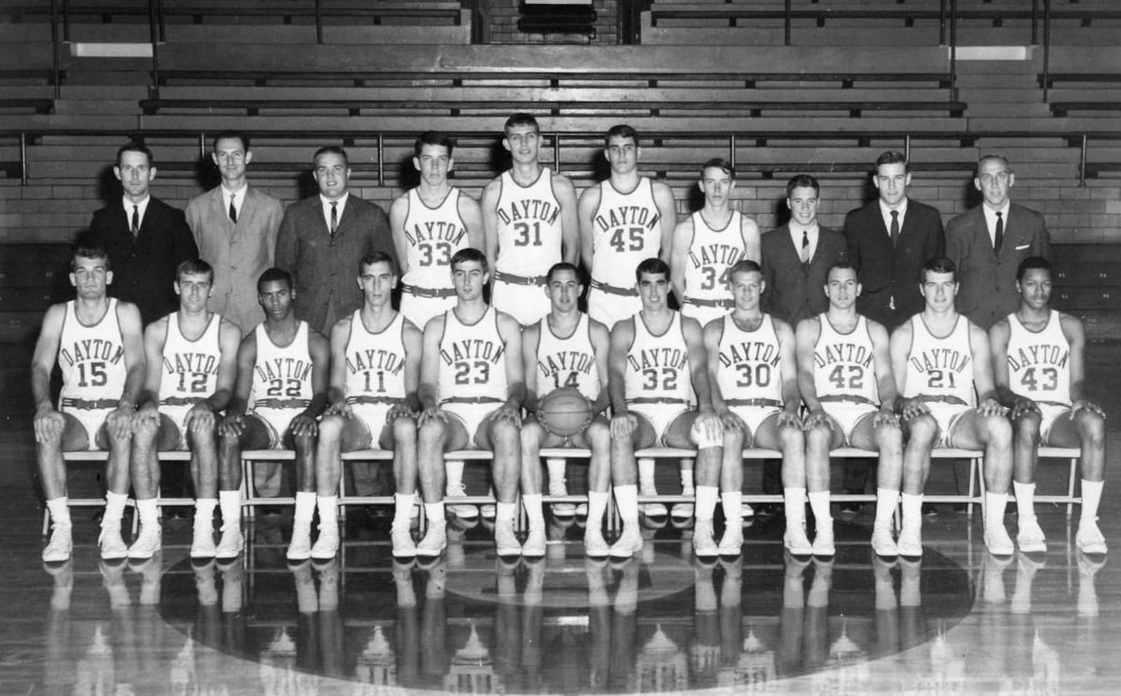 The 1967 University of Dayton basketball team. First Row, From Left: John Rohm, Rich Fox, Rudy Waterman, John Samanich, Gene Klaus, Dennis Papp, Dave Inderrieden, Bob Hooper, Don May, Glinder Torain.
Second Row, From Left: Don Donoher, Head Coach ; Chuck Grigsby and Chuck Izor, Assistant Coaches; Dan Sadlier, Dan Obrovac, Ned Sharpenter, Tom Heckman, Managers Joe Emmerick and Dave Borchers, Tom Frericks, Athletic Director.