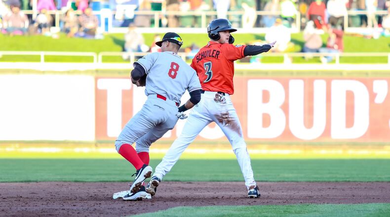 Dayton Dragons designated hitter Jay Schuyler signals safe after being tagged late by Great Lakes Loons second baseman Leonel Valera after a stolen base attempt during their game on Friday night at Fifth Third Field. The Dragons lost 7-5. CONTRIBUTED PHOTO BY MICHAEL COOPER