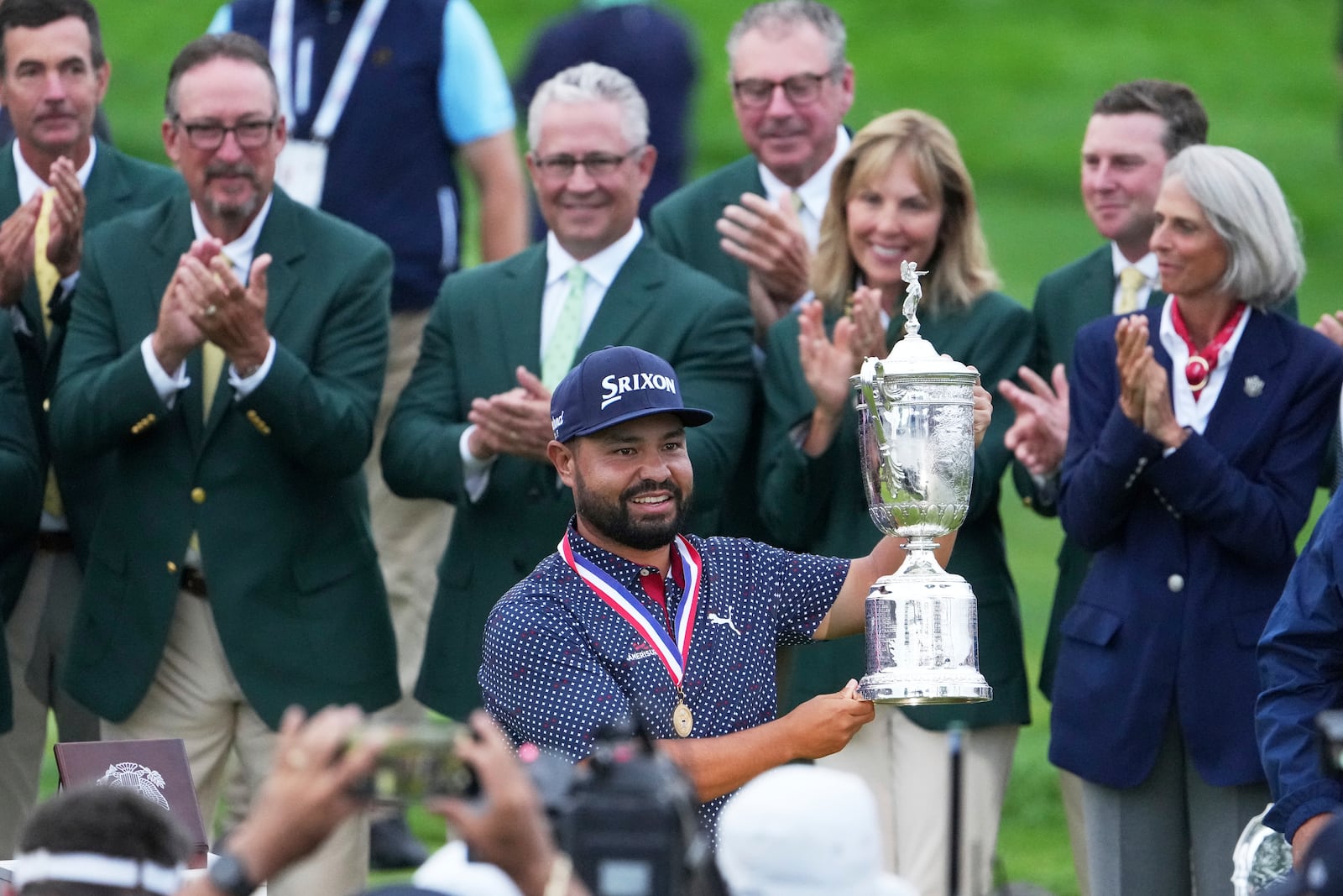J.J. Spaun celebrates with the trophy after winning the U.S. Open golf tournament at Oakmont Country Club Sunday, June 15, 2025, in Oakmont, Pa. (AP Photo/Gene J. Puskar)
