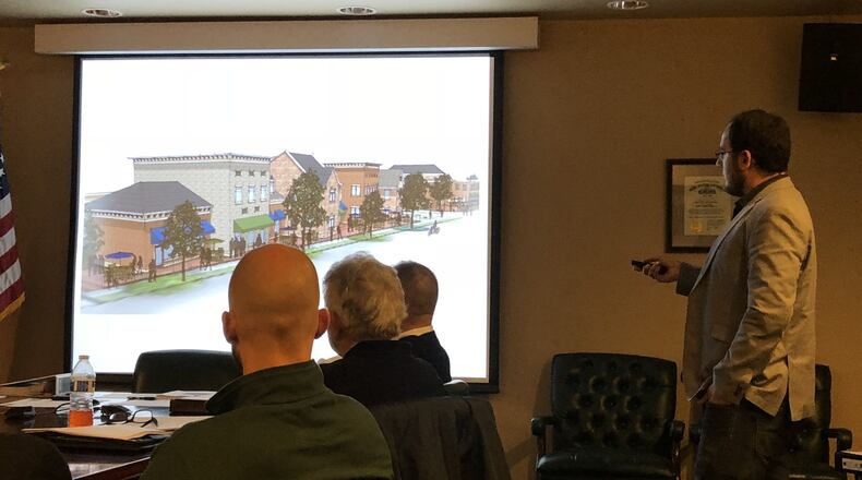 Architect Stephen Starkey queries Lebanon City Council about design features during an earlier meeting on the $18 million development proposed at 511 N. Broadway in Lebanon. On Tuesday, the council OKed an application for a grant to help pay for a $650,000 trail required in the agreement between the city and developer. STAFF/LAWRENCE BUDD