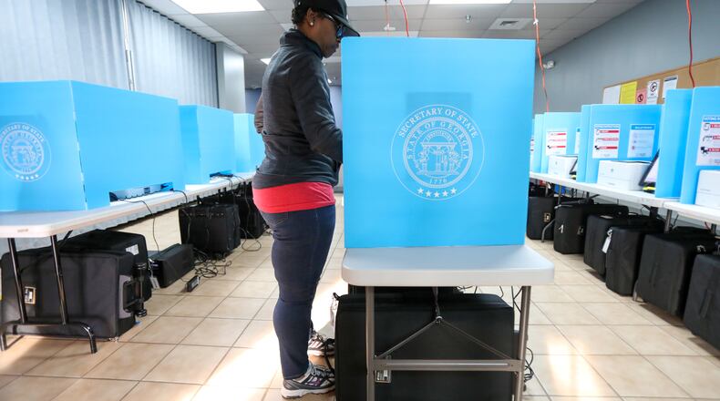 Yolanda Norman of Dekalb County uses te new voting machines at Voter Registration and Elections Office in Atlanta on Monday, March 2, 2020.