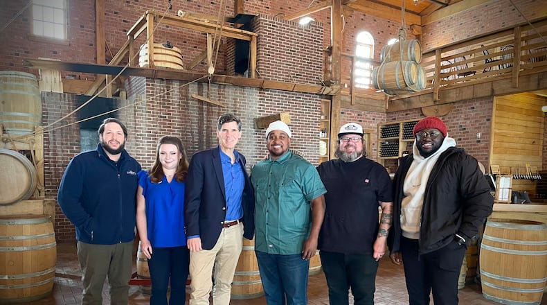 Carillon Brewing Co. is teaming up with Dayton Barbecue Company for the rebirth of its food program. Pictured (left to right) is Head Brewer Kyle Spears, Director of Restaurants & Retail Emily Teters, President & CEO Brady Kress, Owner Eric Evans, Executive Chef Ashley Ashbrook and Owner Ezekiel Cowell. NATALIE JONES/STAFF