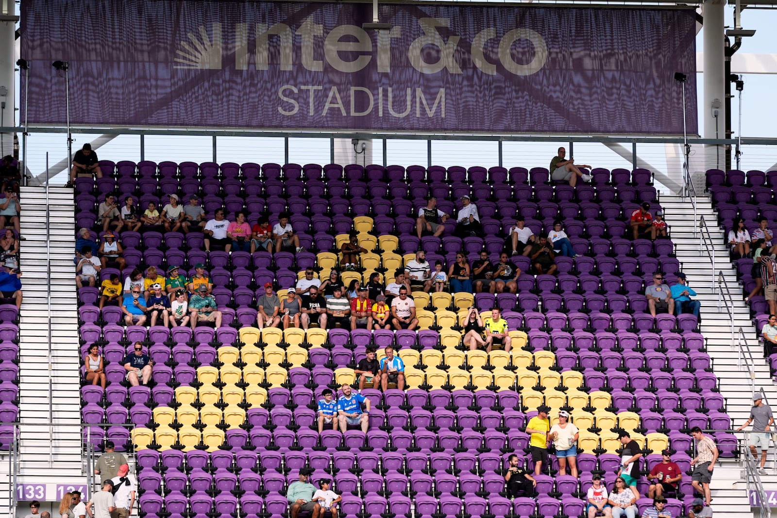 Many seats are empty as teams warm up before the Club World Cup group F soccer match between Ulsan HD and Mamelodi Sundowns in Orlando, Tuesday, June 17, 2025. (AP Photo/John Raoux)