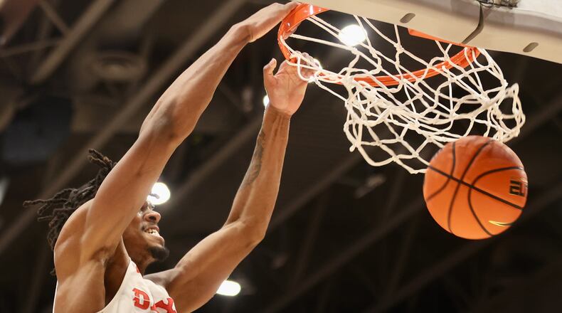 Dayton's DaRon Holmes II dunks against George Mason on Saturday, Feb. 25, 2023, at UD Arena. David Jablonski/Staff