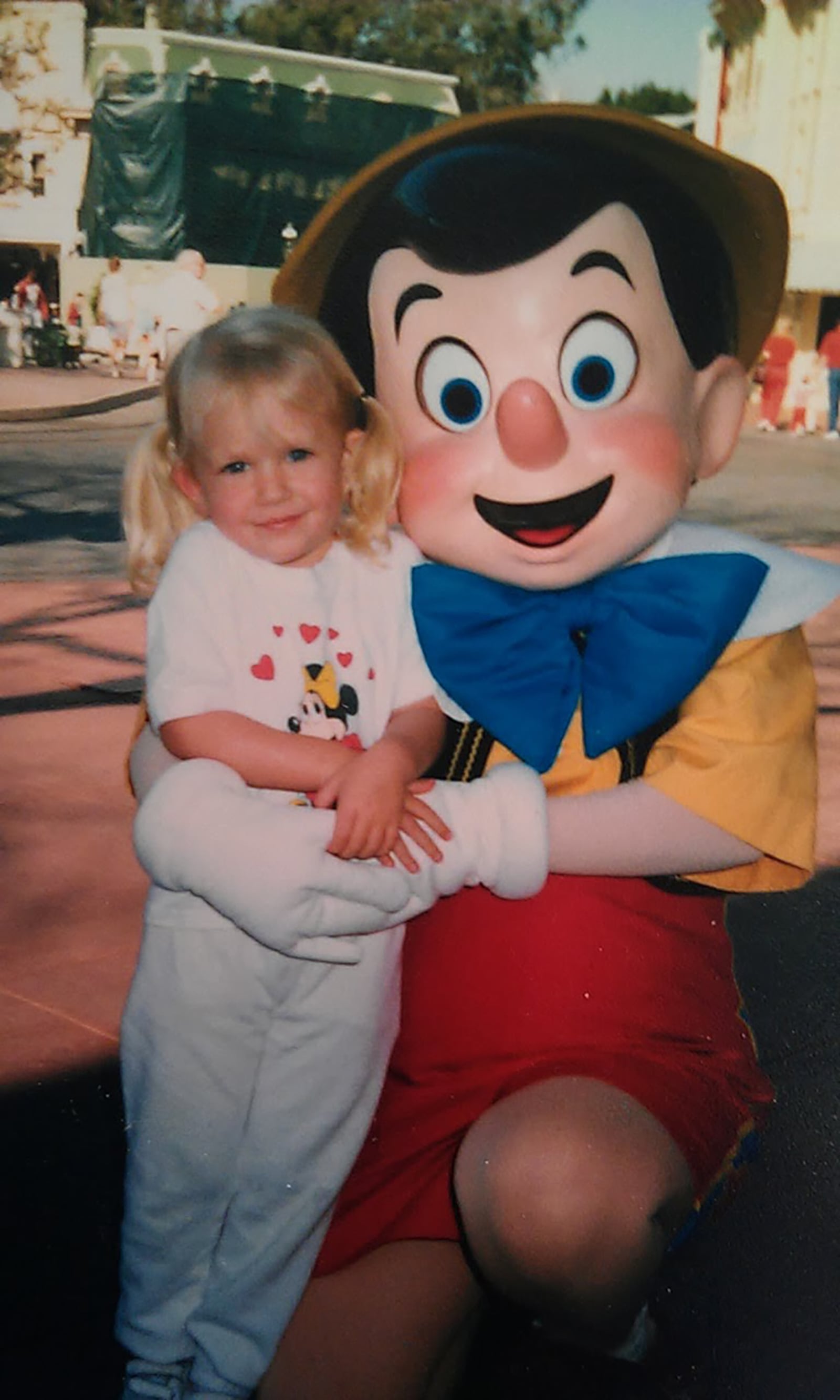Ashley Campbell as a young child at Disneyland with character Pinocchio. Her love of Disney magic began in her early years. CONTRIBUTED