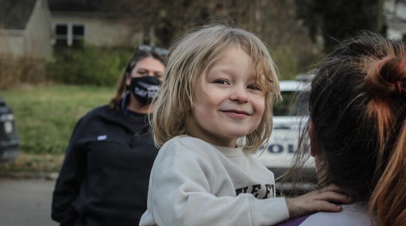 Three year old, Christopher Rohrback and his mother, Ashley Ambrose, right, recently moved to Dayton and needed help. Dayton police and fire helped the family with with clothing, appliances and furniture.