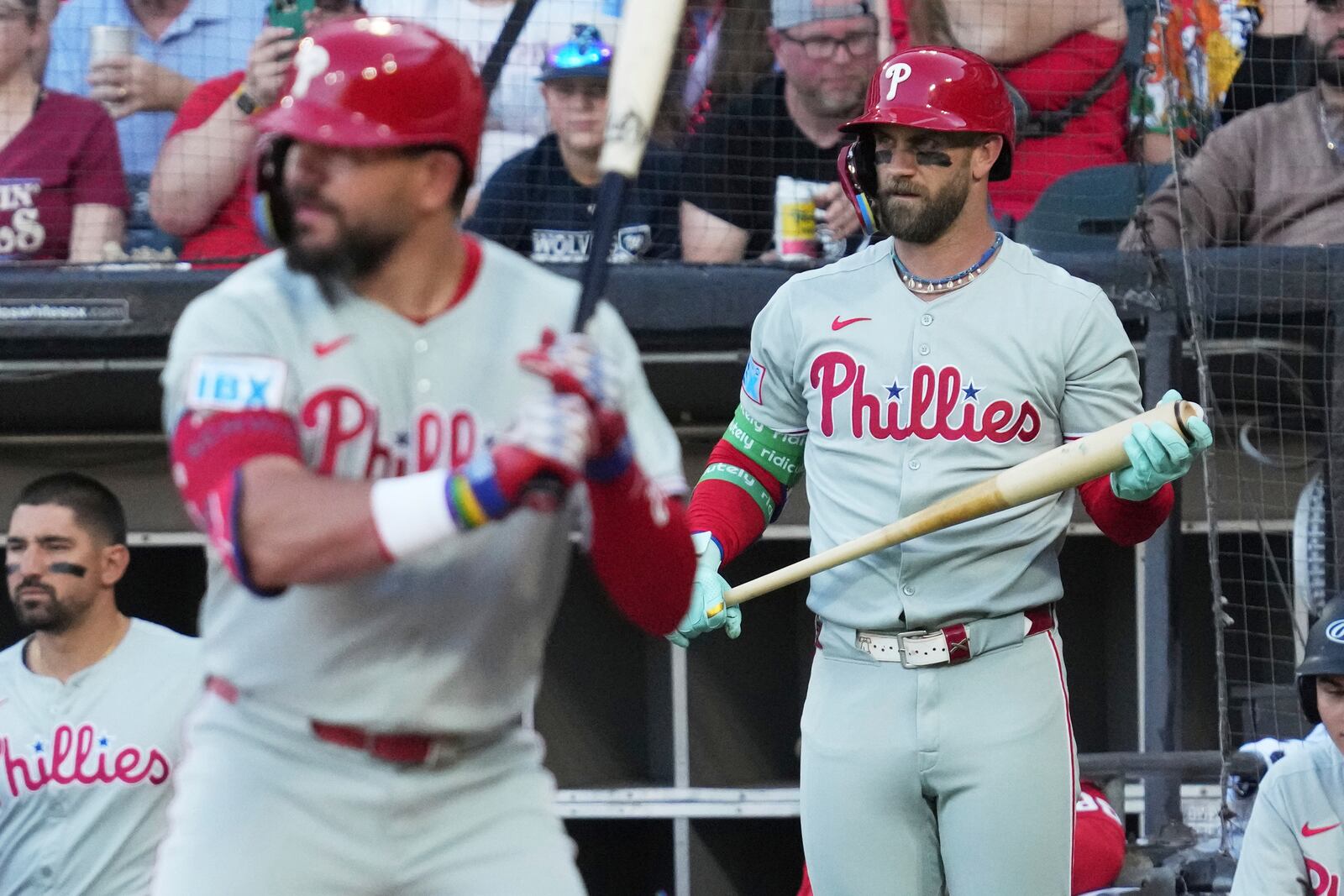 Philadelphia Phillies' Bryce Harper, right, watches Chicago White Sox starting pitcher Davis Martin (not shown) during the first inning of a baseball game in Chicago, Monday, July 28, 2025. (AP Photo/Nam Y. Huh)