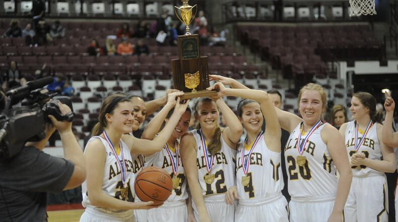 Alter seniors Libby Bazelak (left), Braxtin Miller, Olivia Gillis, Nicole Hoeflinger, Lauren Lush and Emily Long hoist the D-II championship trophy. Alter defeated Shaker Heights Hathaway Brown 58-41 to win its third straight D-II girls high school basketball state championship at OSU’s Schottenstein Center in Columbus on Saturday, March 18, 2017. MARC PENDLETON / STAFF