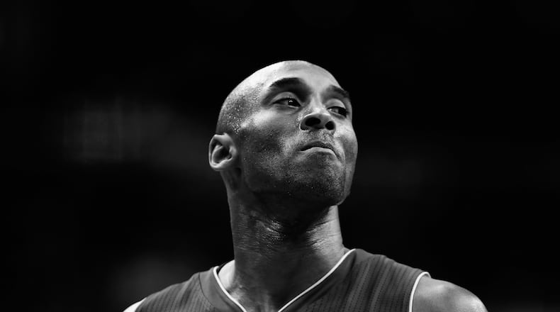 WASHINGTON, DC - DECEMBER 02: (Editors Note: Image has been converted to black and white) Kobe Bryant #24 of the Los Angeles Lakers looks on against the Washington Wizards in the first half at Verizon Center on December 2, 2015 in Washington, DC.  NOTE TO USER: User expressly acknowledges and agrees that, by downloading and or using this photograph, User is consenting to the terms and conditions of the Getty Images License Agreement.  (Photo by Rob Carr/Getty Images)