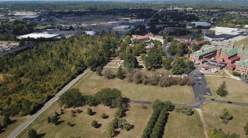 The Sisters of the Precious Blood are looking to add solar arrays in two fields on their property (middle and bottom right) to supply electric to their Salem Heights House (top middle, just on the other side of the cemetery) that houses about 45 retired Sisters. It is at the corner of Denlinger Road and Salem Avenue. CHUCK HAMLIN/STAFF