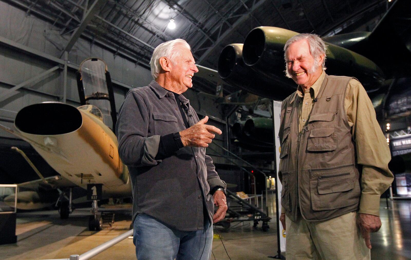 Aviation legends Dick Rutan, left, and his brother Burt Rutan, toured the National Museum of the U.S. Air Force on Thursday.  Both men visited aircraft that were significant parts of their careers including this F-100F Super Sabre in which Dick Rutan flew mission in Vietnam.  Burt Rutan climbed into the XC-124 tiltwing aircraft he helped design in the 1960's, just after completing college.    TY GREENLEES / STAFF