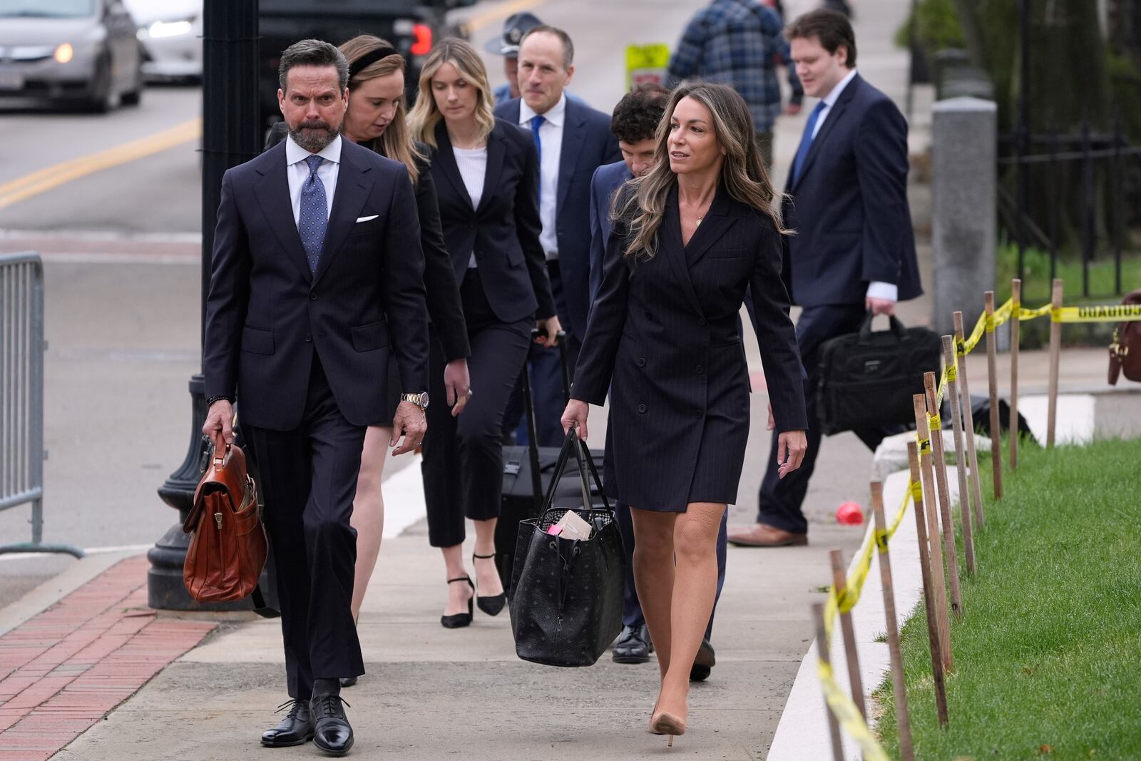 Karen Read arrives with her defense team for her trial at Norfolk Superior Court, Tuesday, April 22, 2025, in Dedham, Mass. (AP Photo/Charles Krupa)