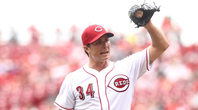 Reds starter Homer Bailey reacts after giving up a home run in the first inning against the Nationals on Sunday, July 16, 2017, at Great American Ball Park in Cincinnati. David Jablonski/Staff