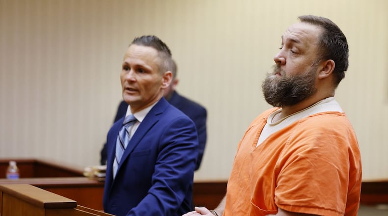 Michael Maloney, right, with attorney Ched Peck, appeared in Butler County Common Pleas Court for a hearing Wednesday, May 25, 2022 on charges in connection with pouring hot oil on a woman and child. NICK GRAHAM/STAFF