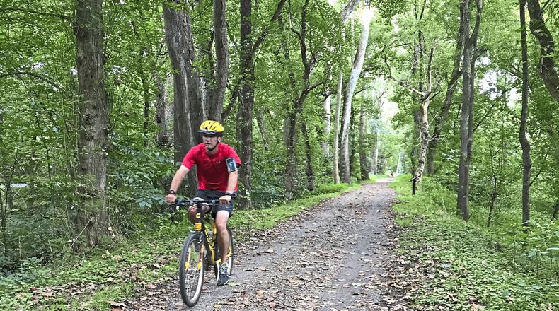 A cyclist rides on the C&O Canal Towpath between Harpers Ferry and Sheperdstown, W. Va. (Virginia Linn/Pittsburgh Post-Gazette/TNS)