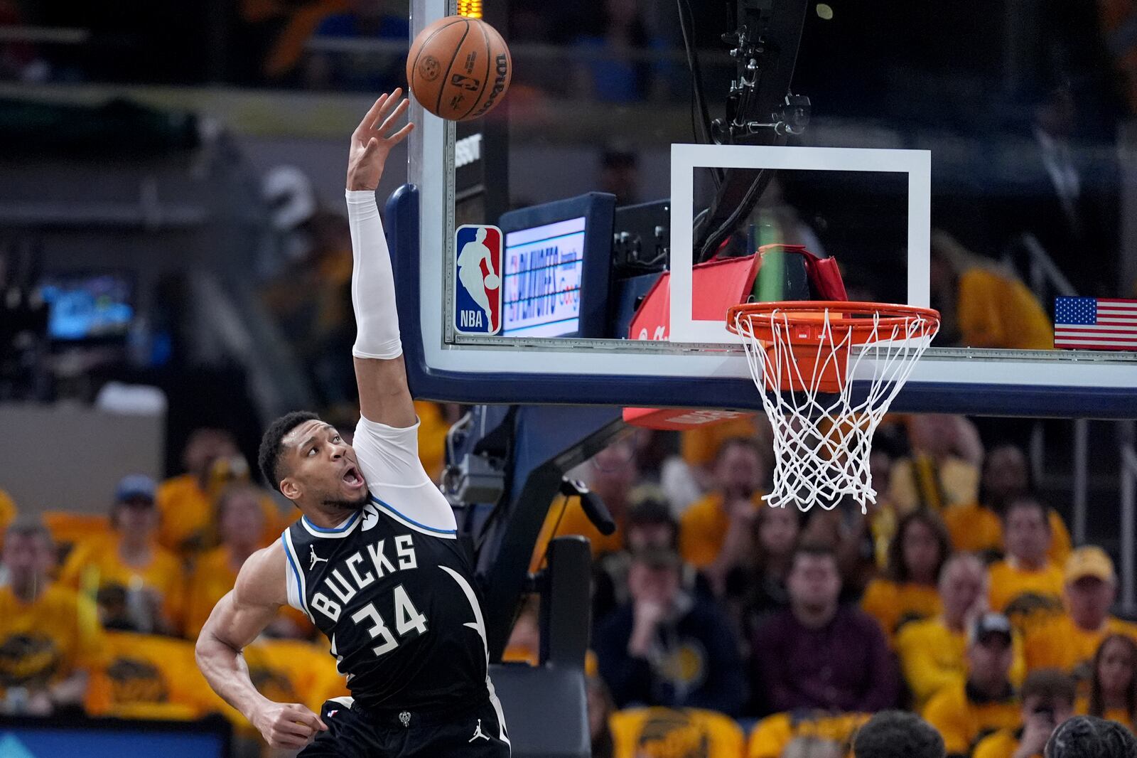 Milwaukee Bucks' Giannis Antetokounmpo (34) reaches for a rebound during the first half of a first-round NBA basketball playoff game against the Indiana Pacers, Saturday, April 19, 2025, in Indianapolis. (AP Photo/Michael Conroy)