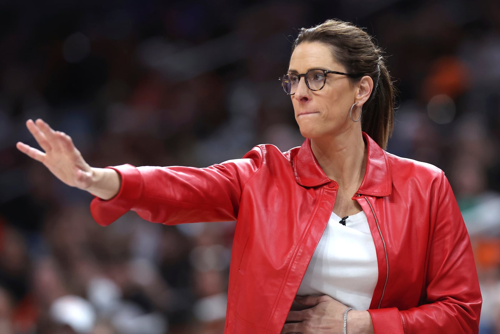 Indiana Fever head coach Stephanie White gestures during the second half of a WNBA basketball game against the Connecticut Sun, Tuesday, July 15, 2025, in Boston. (AP Photo/Michael Dwyer)