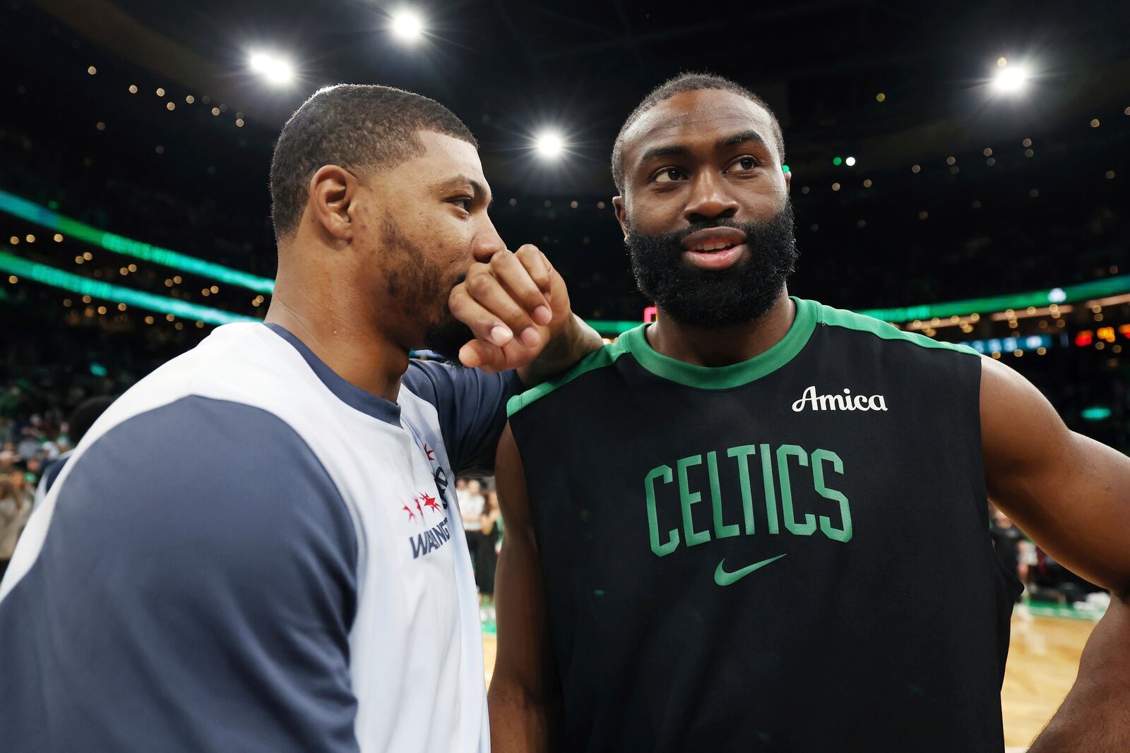 Boston Celtics' Jaylen Brown, right, talks with former teammate, Washington Wizards' Marcus Smart, following an NBA basketball game Sunday, April 6, 2025, in Boston. (AP Photo/Michael Dwyer)