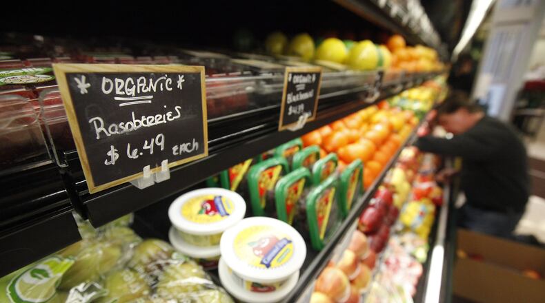 In this file photo from 2011, a worker stocks the shelves at Health Foods Unlimited, 2250 Miamisburg-Centerville Road. Staff photo by Jim Witmer