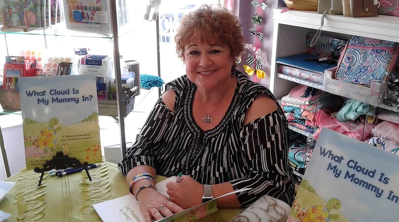 Kim Vesey is seen at a book signing for her first book, "What Cloud is My Mommy In?" inspired by her grandson, Warren's question to her after he lost his mom when he was just 4 years old. CONTRIBUTED