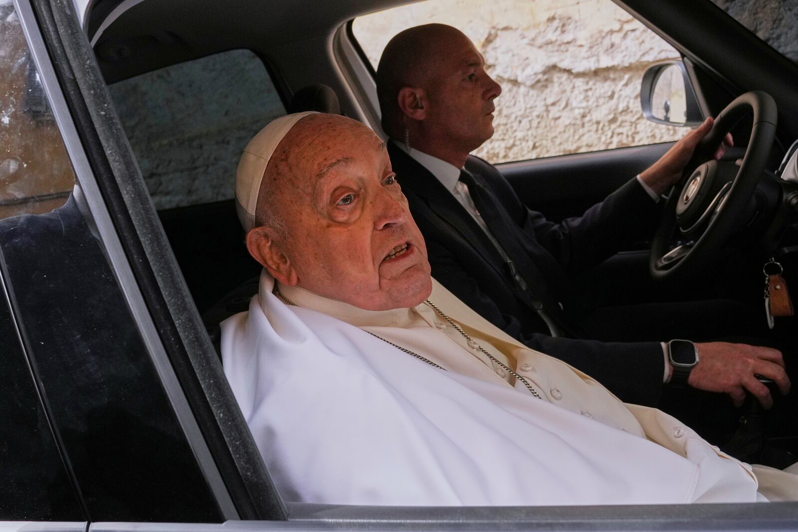 Pope Francis talks to journalists as he leaves at the end of his visit to the Regina Coeli penitentiary in Rome on Holy Thursday, Thursday, April 17, 2025. (AP Photo/Andrew Medichini)