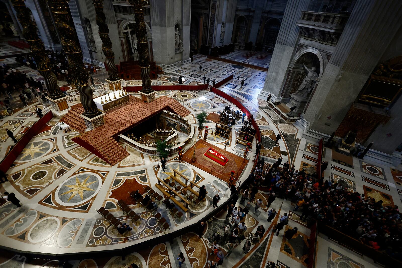 People queue to pay their respect to the late Pope Francis, who will lie in state at St. Peter's Basilica for three days, at the Vatican, Wednesday, April 23, 2025. (Cecilia Fabiano/LaPresse via AP)