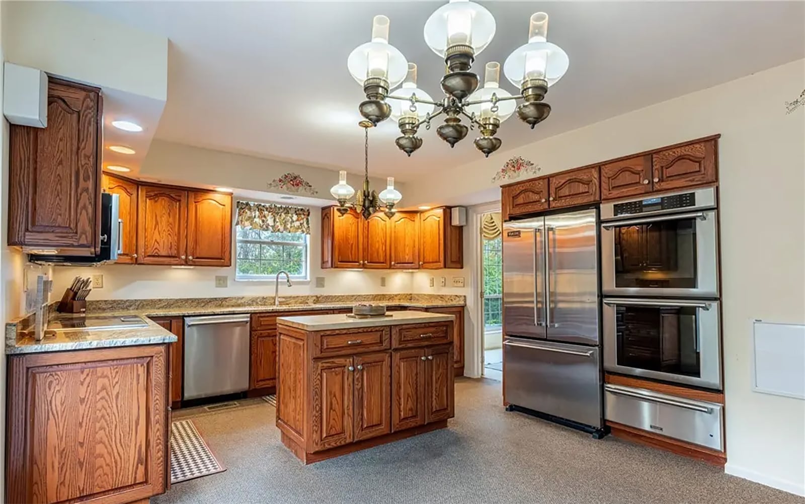 The kitchen has been updated with chef's high end appliances including an electric cooktop, wall ovens, dishwasher, microwave and French door refrigerator. CONTRIBUTED