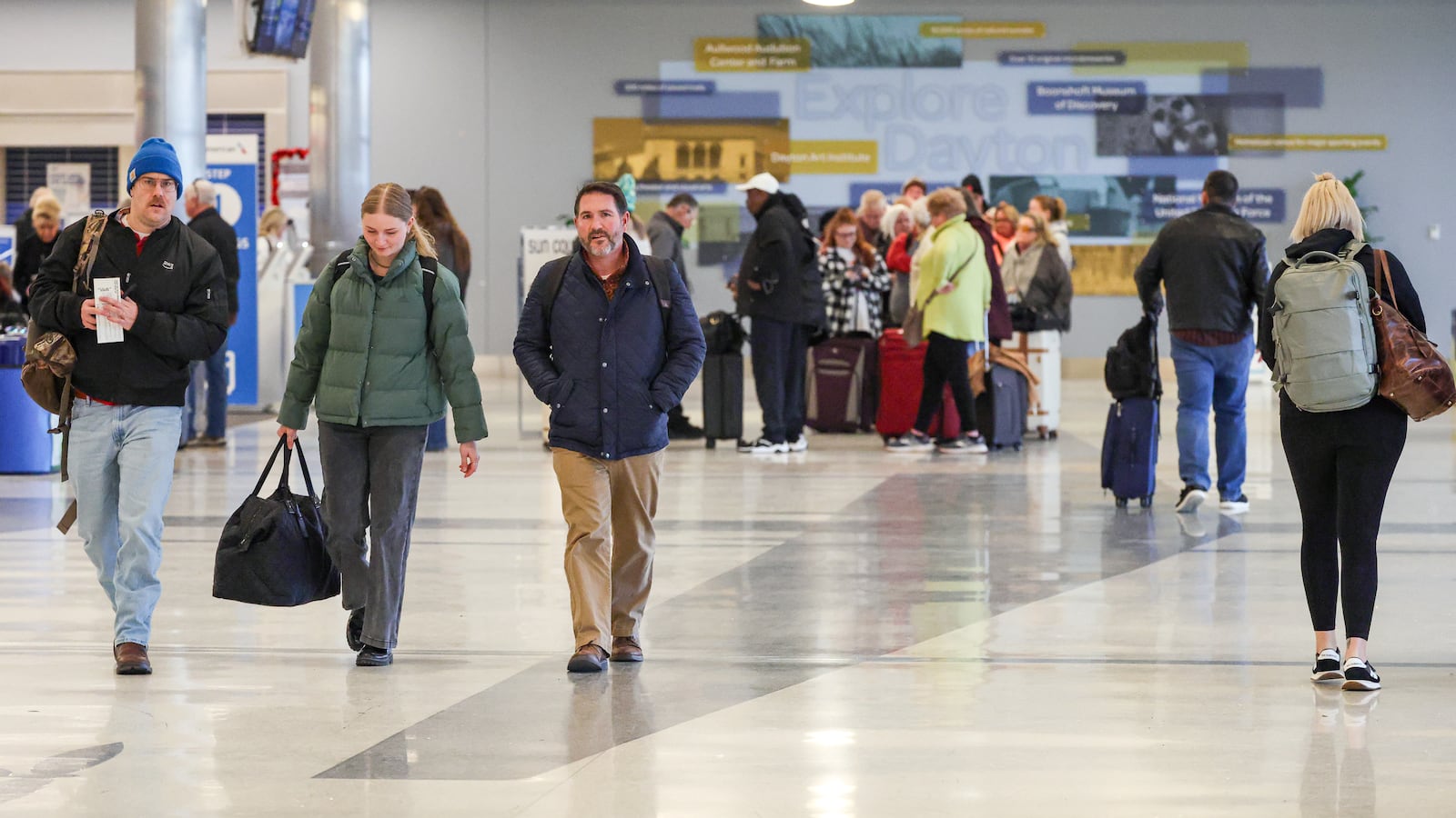 Passengers walk through the terminal at James M. Cox Dayton International Airport on Thursday, Dec. 11. AAA projects 122.4 million Americans will travel at least 50 miles from home over the 13-day year-end holiday period beginning Dec. 20 and ending Jan. 1. This will be the first time on record that the number of domestic air travelers over the year-end holiday period exceeds eight million. BRYANT BILLING/STAFF
