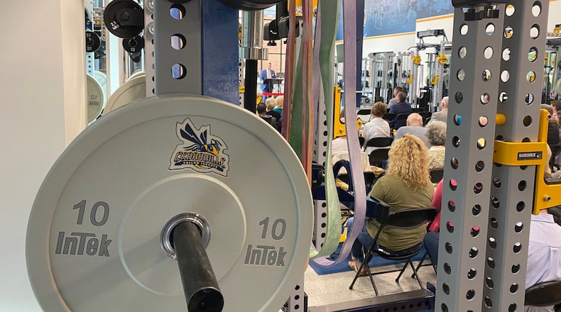 Dr. Thomas White speaks at the Callan Athletic and Academic Expansion dedication in the new weight room within the facility at Cedarville University. CONTRIBUTED