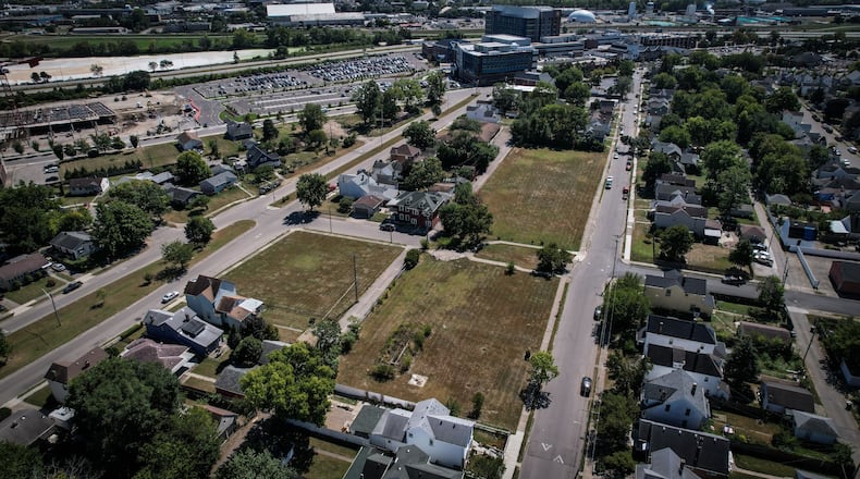 Dayton Children's wants to build new kinship housing on this vacant land in Old North Dayton. Dayton Children's can be seen in the background; Alaska Street is on right and Rita Street is on the left. JIM NOELKER/STAFF