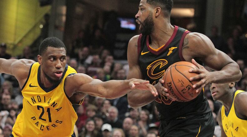 FILE: Cleveland Cavaliers center Tristan Thompson keeps the ball from Indiana Pacers forward Thaddeus Young in the first quarter of Game 7 during the Eastern Conference First Round series on Sunday, April 29, 2018 at Quicken Loans Arena in Cleveland, Ohio. The Cavs won the game, 105-101. (Leah Klafczynski/Akron Beacon Journal/TNS)