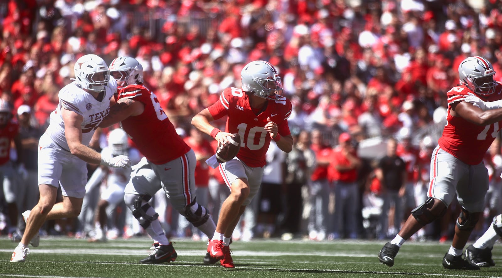 Ohio State's Julian Sayin scrambles against Texas on Saturday, Aug. 30, 2025, at Ohio Stadium in Columbus. David Jablonski/Staff