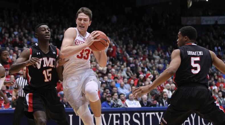 Dayton’s Ryan Mikesell drives to the basket against VMI on Friday, Dec. 23, 2016, at UD Arena. David Jablonski/Staff