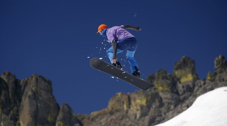 Max Ranall, of San Francisco, catches some air on his snowboard on the slopes of the “Gold Coast Face” run at Squaw Valley in Lake Tahoe, Calif. on Sunday, June 25, 2017. (Josie Lepe/Bay Area News Group/TNS)