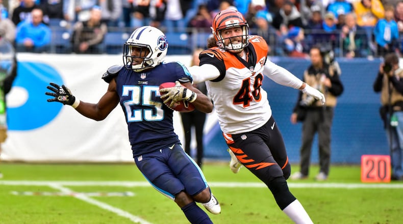 NASHVILLE, TN - NOVEMBER 12: Corner Back Adoree’ Jackson #25 of the Tennessee Titans carries the ball against Long Snapper Clark Harris #46 of the Cincinnati Bengals at Nissan Stadium on November 12, 2017 in Nashville, Tennessee. (Photo by Frederick Breedon/Getty Images)