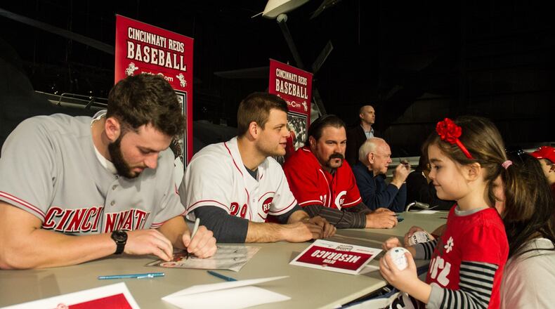 National Museum of the U.S. Air Force visitors will have the opportunity to meet members of the Cincinnati Reds organization on Jan. 19 from 11 a.m. - 2 p.m. Here pitcher Cody Reed signs an autograph for a fan in 2016, and will be one of the Reds returning to the museum again this year. (U.S. Air Force photo)