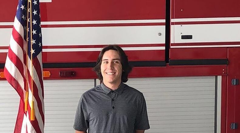 Connor Tabarini stands in front of a fire engine at the Idaho Air National Guard’s Gowen Field, after enlisting as a fireman in the Air Force Reserve. Tabarini originally wanted to join the Idaho ANG, but there were no positions available in the Air Force Specialty Code he desired. As part of Total Force recruiting, the Guard worked with a Reserve recruiter to assure Tabarini was able to get his dream job. (U.S. Air Force courtesy photo)