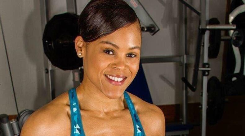 Danielle Burress, 88th Force Support Squadron Community Services flight chief and Air Force Reserve captain, poses in the gym where she trains for bodybuilding competitions Oct. 17. (Courtesy photos)