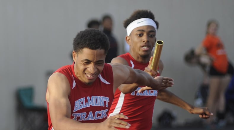 Belmont anchor Makai Lewis (left) takes a handoff from teammate Fred Hoard in the final of the 4x100-meter relay during the D-I regional track and field meet at Welcome Stadium last week. The Bison placed third (42.41) and qualified to this week’s state meet. MARC PENDLETON / STAFF