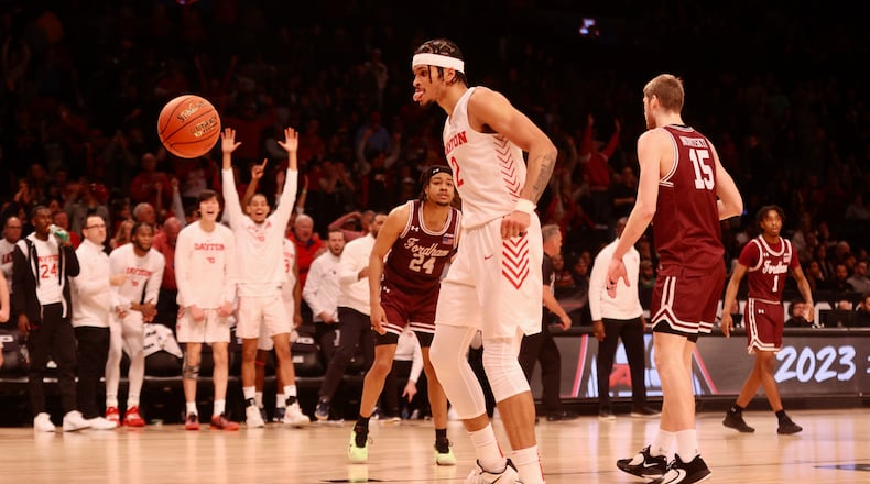Dayton's Toumani Camara reacts after a dunk in the final seconds against Fordham in the semifinals of the Atlantic 10 Conference tournament on Saturday, March 11, 2023, at the Barclays Center in Brooklyn, N.Y. David Jablonski/Staff