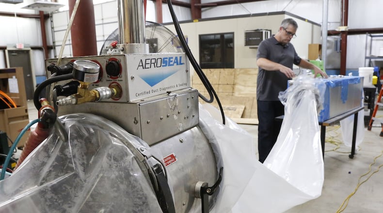 Kevin Dugan, director of marketing and communications, sets up an AeroSeal demonstration inside it’s manufacturing building in Centervlle. The air duct sealing business is consolidating two locations in Centerville to a new location on Byers Road in Miamisburg. TY GREENLEES / STAFF Manufacturing building of AeroSeal in Centervlle. The air duct sealing business is consolidating two locations in Centerville to a new location on Byers Road in Miamisburg. TY GREENLEES / STAFF