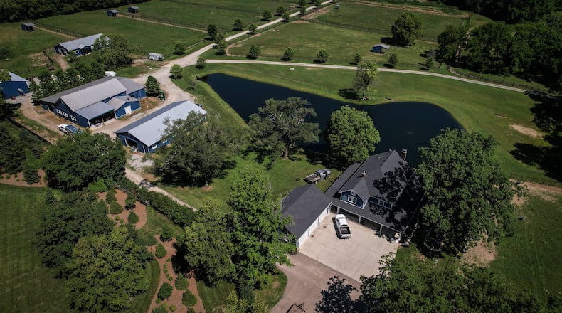 A Clearcreek Twp. police officer remains in critical condition after being shot in the 5000 block of Ohio 48 Wednesday evening. JIM NOELKER/STAFF