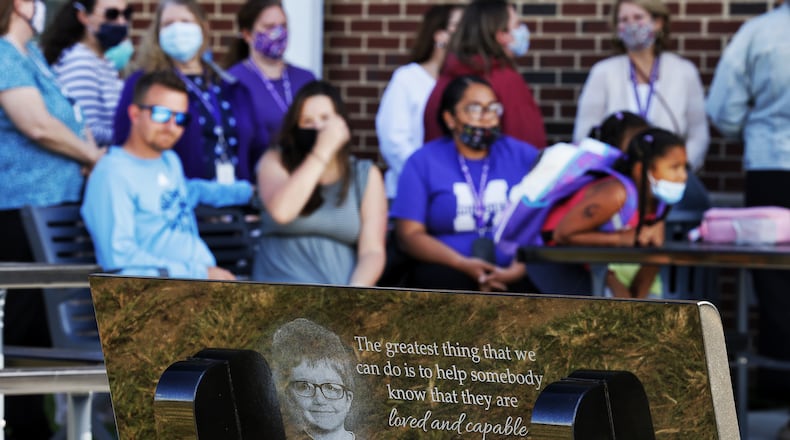 A dedication was held Thursday, Sept. 9, 2021 at Rosa Parks Elementary School in Middletown for a black granite bench in memory of James Hutchinson who was killed by his mother. Hutchinson was a student at Rosa Parks Elementary. NICK GRAHAM / STAFF