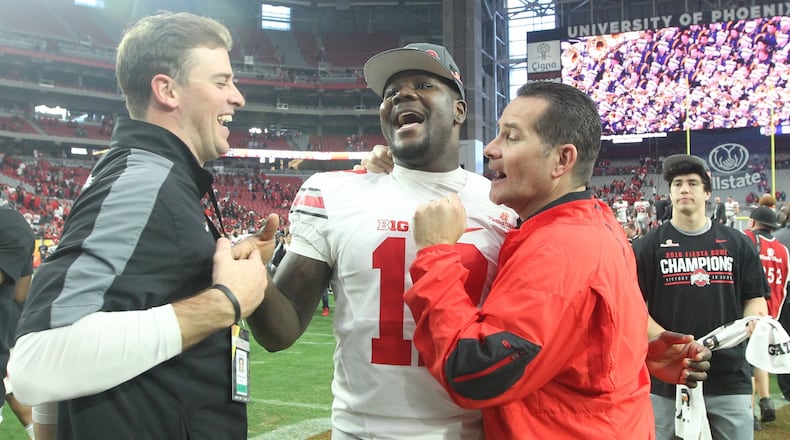 Ohio State’s Cardale Jones, center, hugs quarterbacks coach Tim Beck after a victory against Notre Dame in the Fiesta Bowl on Friday, Jan. 1, 2016, at University of Phoenix Stadium in Glendale, Ariz. David Jablonski/Staff
