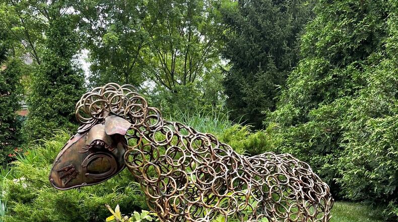The Garden Club of Dayton is hosting a tour of six Oakwood and Kettering homes on Saturday, June 11. Beyond plants, some of the gardens include sculptures and water features. NANCY DANKOF/COURTESY PHOTO