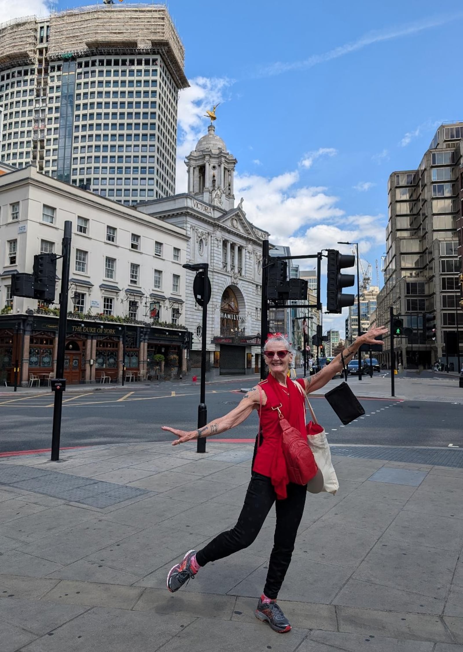 Nancy Boss poses in an arabesque near Victoria station and the Victoria Palace Theatre, the home of the hit musical "Hamilton," in London, England in December 2024. CONTRIBUTED