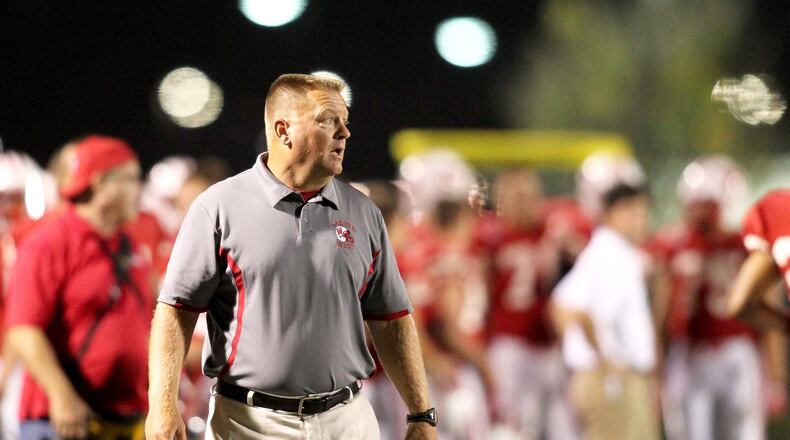 Lakota West coach Larry Cox paces the sideline during a game against visiting Fairfield on Oct. 11, 2013. JOURNAL-NEWS FILE PHOTO