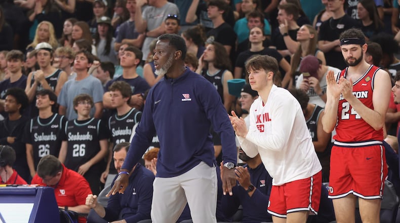 Dayton's Anthony Grant reacts to a play during a game against North Carolina Wilmington in the first round of the National Invitation Tournament on Saturday, March 21, 2026, at Trask Coliseum in Wilmington, N.C.. David Jablonski/Staff